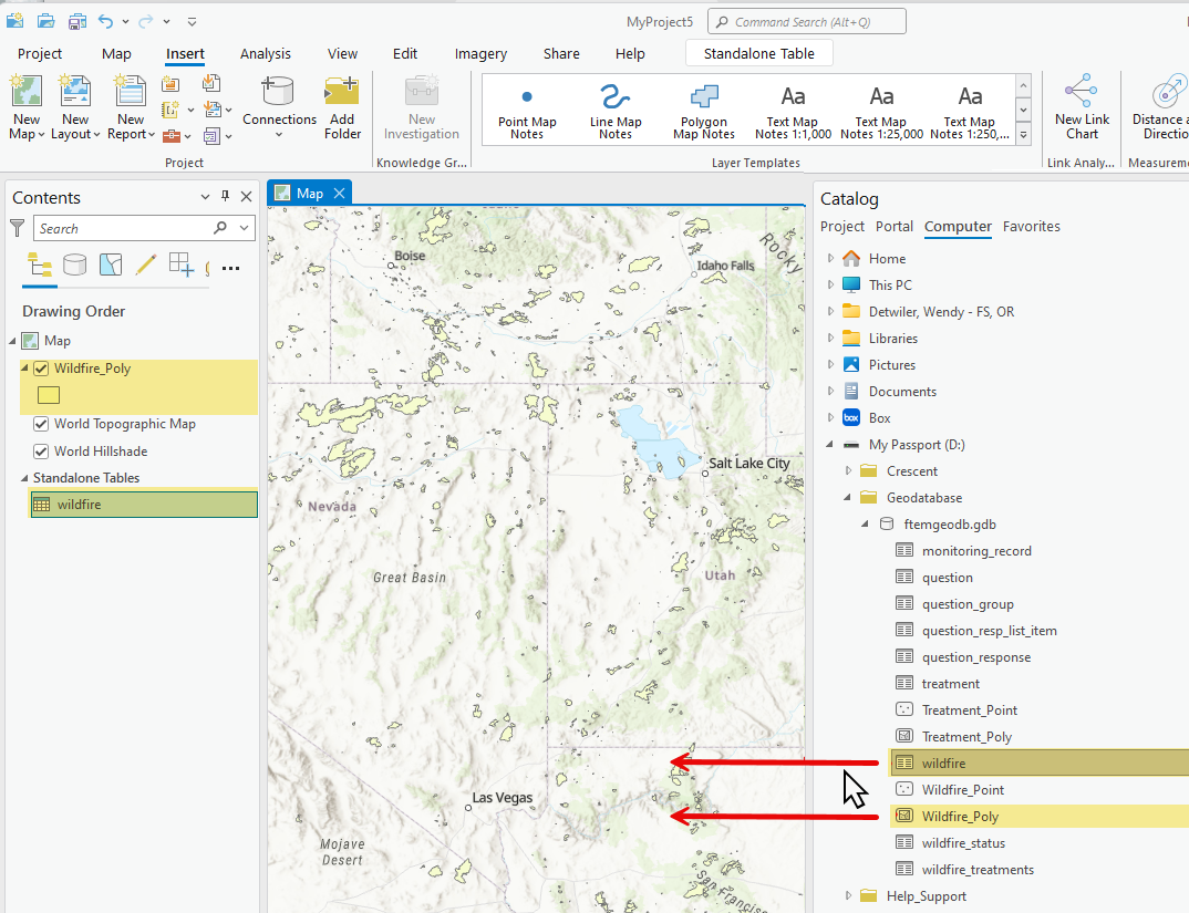 mouse cursor with arrows next to a feature and table, pointing toward the map.