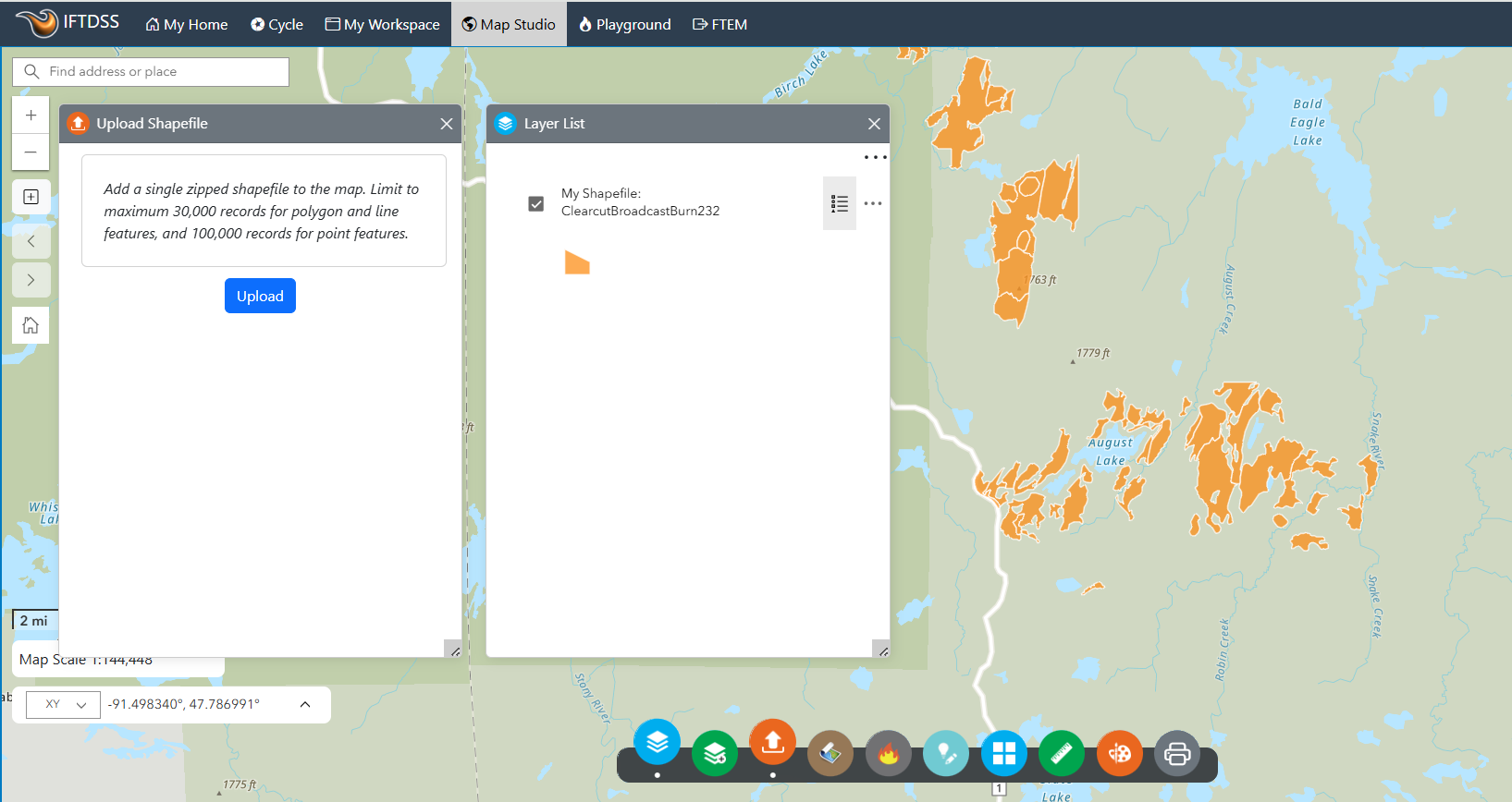 orange shapefiles are displayed on the map to the right of the Layer List box and Upload Shapefile box.