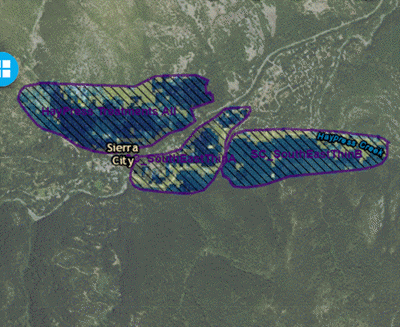 A valley with three polygons in which treatments are indicated with differing colors